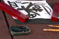 Use ink and a bamboo brush to make traditional Chinese scrolls.