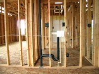PVC sink drain plumbed with a standard vent pipe venting to the roof