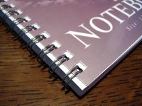 Add personality to your spiral notebooks with scrapbook supplies.