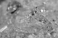 Crush glass bottles into tiny pieces to recycle it for many uses.