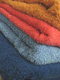 Towels are a frugal, creative way to wrap bathroom or kitchen-related gifts.