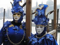 Carnival masks are typically paired with dazzling costumes.