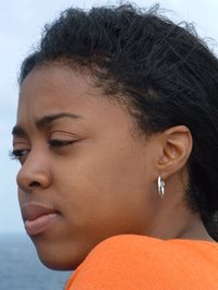 Keep relaxed hair looking fresh by using a hot comb.