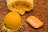 Spa essentials: towel, candle and bar of soap