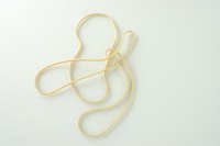Learn how to form a rubber band into three stars.