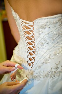 A girdle has lacing on the back, similar to a corset.