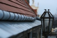 Tiled roofs need gutters to protect the building beneath.