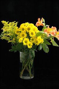 Acryic water used in combination with silk flowers creates the illusion of real water.