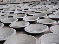 Customize plain dinner plates with handmade designs.