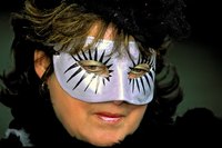 Simple, yet striking results can be achieved by using only two or three colors of paint when decorating masks.