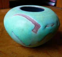 Glazing pots provides an artistic appeal and seals them for food and liquid use.
