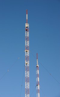 A pair of antennas for broadcasting radio signals.