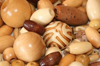 You can use any wooden bead of your choice for your bead cushion.