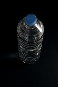 Turn an empty water bottle into a noisemaker.