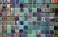 Seal the grout around glass tiles to keep the installation looking new.