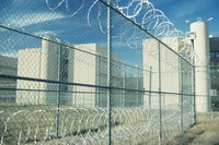 Prison snipers observe activities in the prison yard.