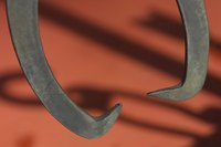 Grabbers usually are long, straight objects with claws at the bottom end.