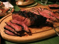 London broil is a long, flat cut of beef, grilled and served in thin slices.