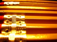 Graphite is housed in a wooden casing to make a pencil.