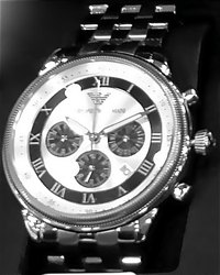 A watch bezel holds down crystal over the dial.