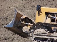 A track bulldozer with a combination blade is a versatile machine.