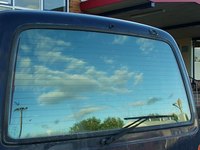 Auto insurance can cover broken glass caused by vandalsim.