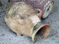 You'll have to prepare a concrete urn before painting it.