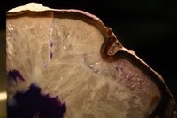 Cutting some rocks exposes the beautiful minerals inside.