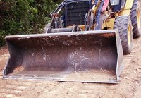 Front-end loaders are common tractor implements.
