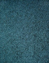 The pores of this asphalt are sealed by tar and grease.