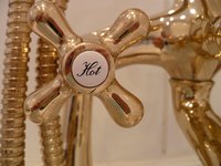 Adjust the water temperature of a hot water boiler.