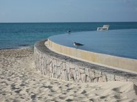 A pool near sand.
