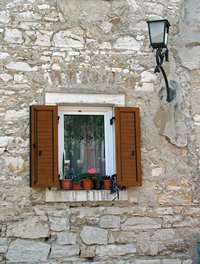 Pella casement and awning windows can be adjusted with a pull-out handle.