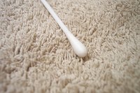 The small tip of a cotton swab allows for precision cleaning.