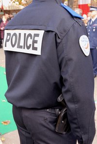 Call the police from a safe place after returning to alarms sounding.
