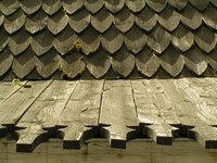 Bare cedar shingles without paint.