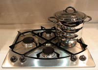 A clean stainless steel stove top.