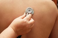 Fluid in the lungs causes pneumonia and can be heard when listening with a stethoscope.
