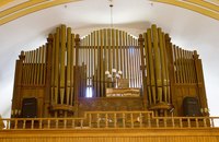 An organ is a complicated instrument with a majestic sound well-suited to hymns and praise music.