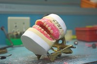Soaking dentures in vinegar can give you a cleaner, whiter smile.
