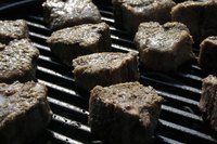 Season the smoke and the food when charcoal grilling.