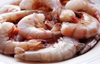 Season cooked shrimp with garlic butter.
