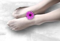 Combine a healthy diet and regular exercise to slim down your feet.
