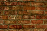 Cover old exposed brick with tile.