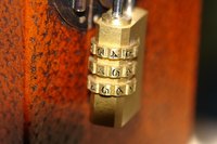 Dial your combination in the suitcase lock to open it.
