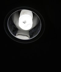 This compact fluorescent light bulb is installed in a recessed can.