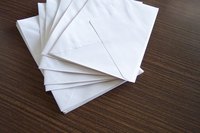 Fold a letter to fit the size of the envelope.