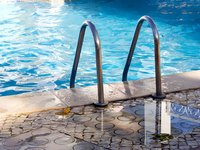 Stone coping is the edge of the pool wall.