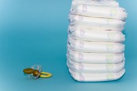 Roll and stack diapers to make a truck themed diaper cake.