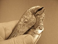 Use locking pliers to turn the tank bleeder valve.
